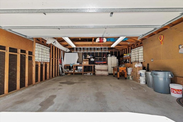 garage featuring white fridge