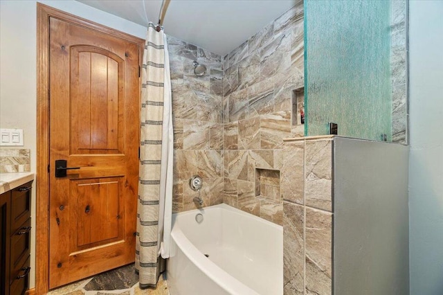 bathroom featuring vanity, tile patterned flooring, and shower / bath combination with curtain