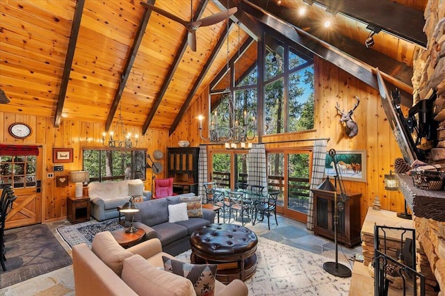 tiled living room featuring beamed ceiling, wooden walls, and plenty of natural light