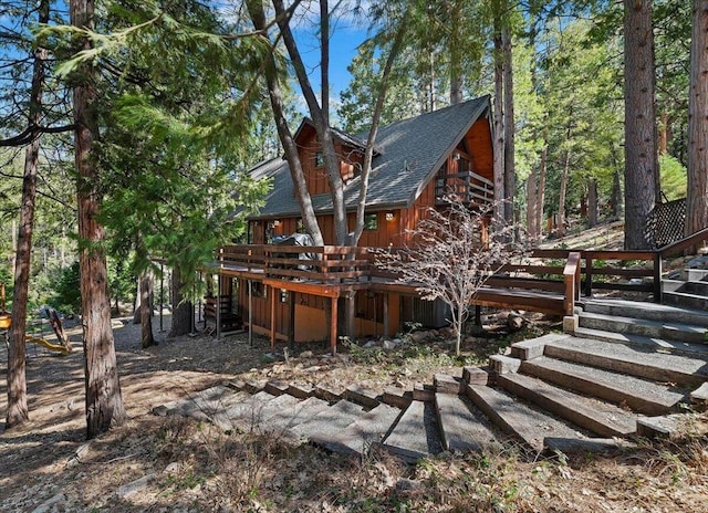 rear view of property with a deck