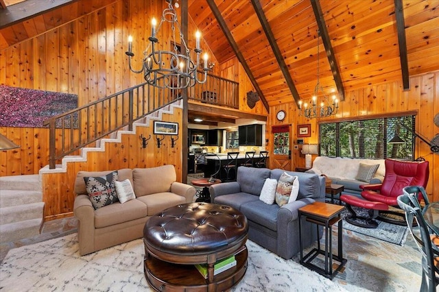 living room with beam ceiling, a notable chandelier, wooden walls, and high vaulted ceiling