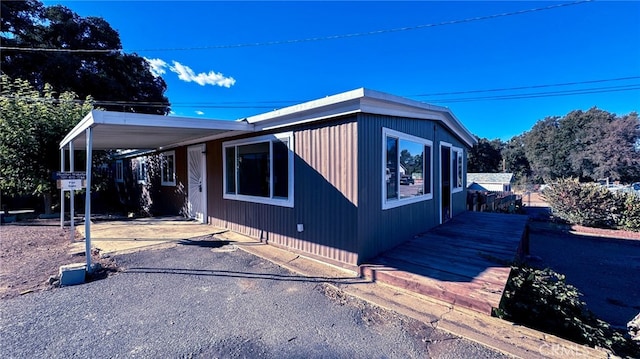 view of home's exterior featuring a carport