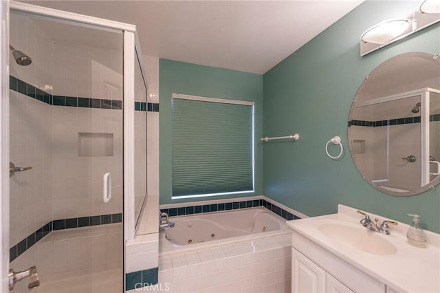 bathroom featuring vanity and independent shower and bath