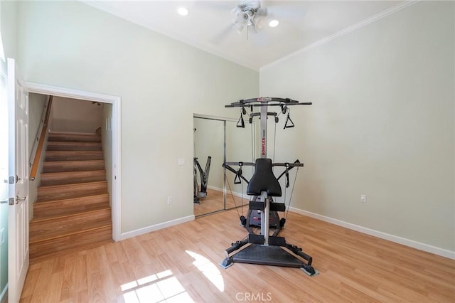 workout area with ceiling fan, ornamental molding, and light wood-type flooring