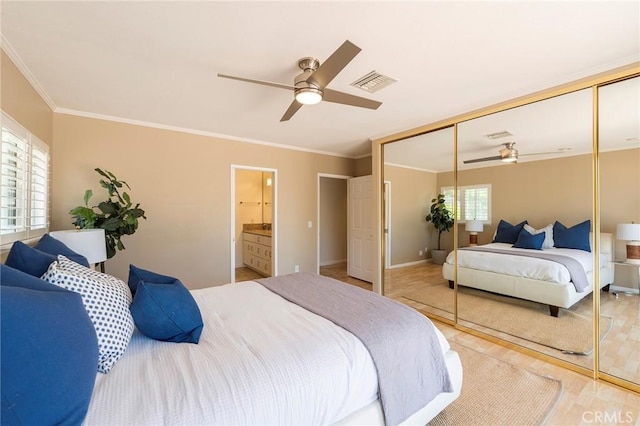 bedroom with multiple windows, light hardwood / wood-style floors, a closet, and ceiling fan