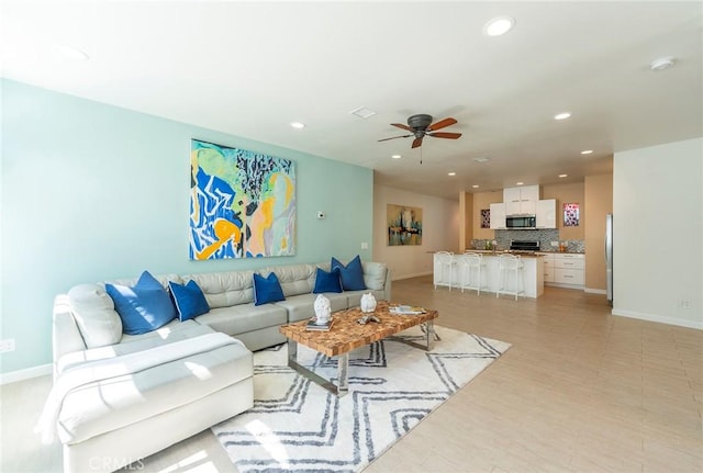 living room featuring ceiling fan