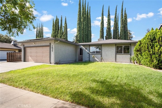 ranch-style home with a front yard, driveway, an attached garage, and stucco siding