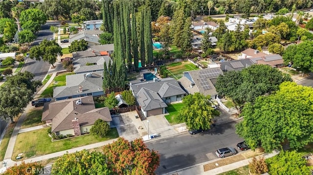 birds eye view of property with a residential view