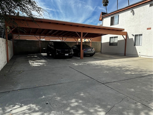 view of vehicle parking with a carport