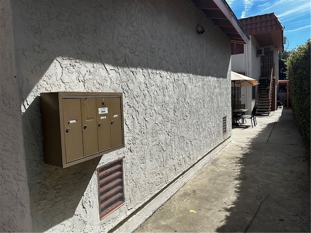 view of side of property with mail boxes