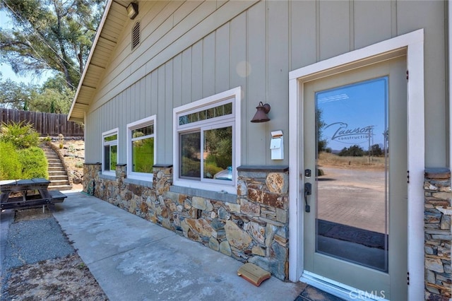 doorway to property featuring a patio