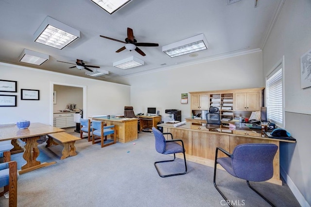 office space featuring light carpet, crown molding, and ceiling fan