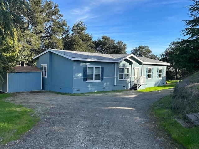 manufactured / mobile home with a shed