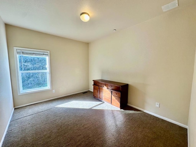 empty room featuring light colored carpet