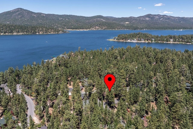 aerial view featuring a water and mountain view