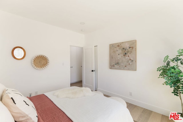 bedroom with light wood-type flooring