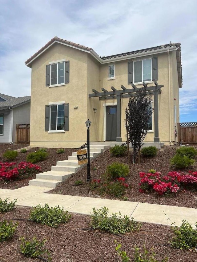 front facade featuring a pergola