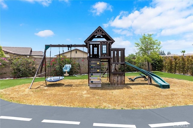 view of jungle gym with a lawn