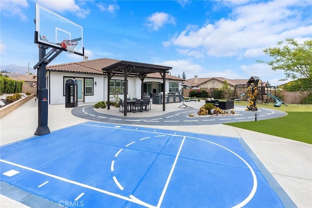 view of basketball court featuring a pergola and a playground