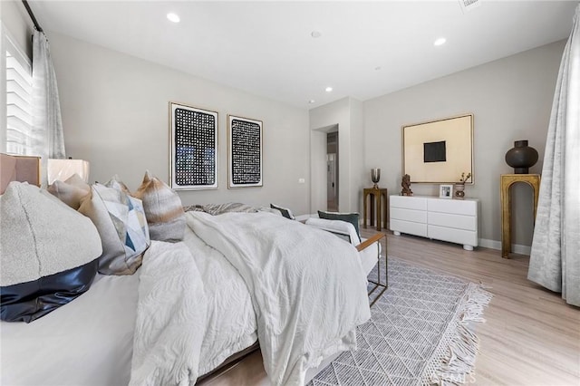 bedroom with light hardwood / wood-style floors