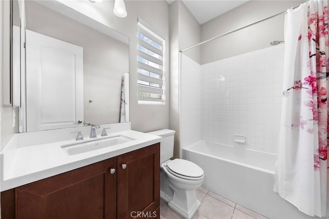 full bathroom with toilet, shower / tub combo, vanity, and tile patterned floors