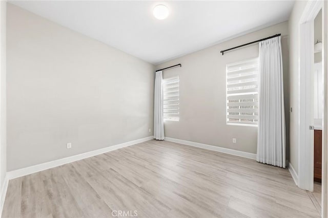 unfurnished bedroom with light wood-type flooring