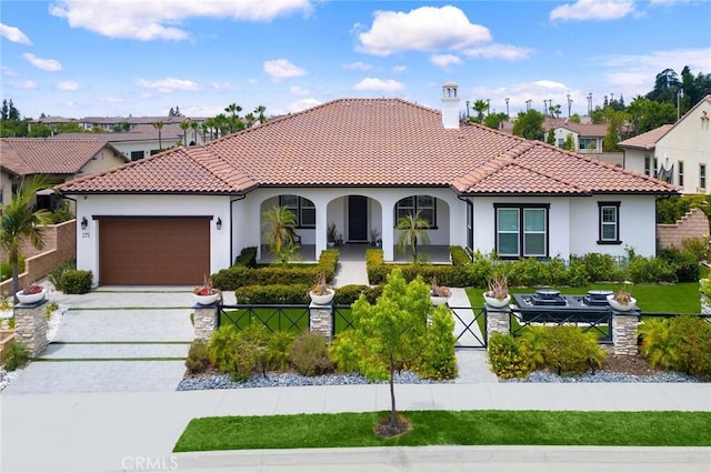 mediterranean / spanish-style house featuring a garage