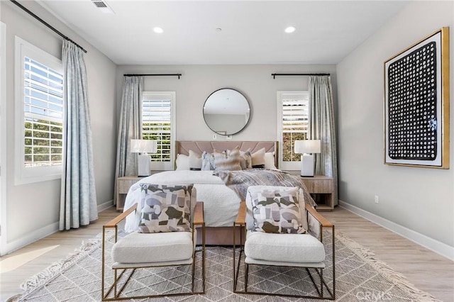 bedroom with light hardwood / wood-style flooring