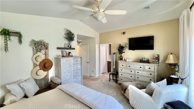 bedroom with ceiling fan, vaulted ceiling, and light carpet