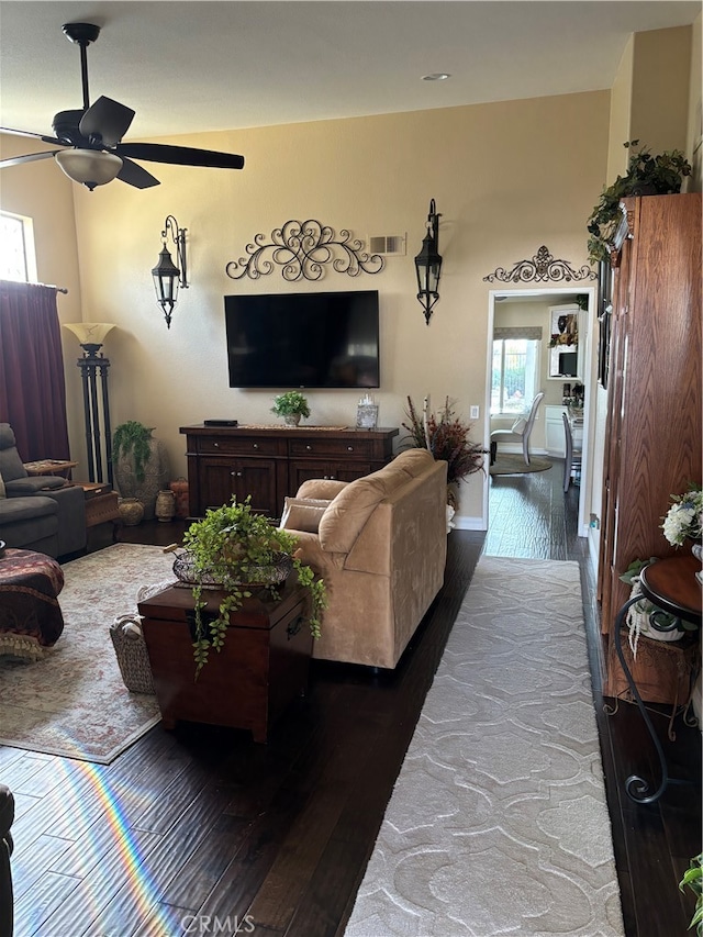 living room with ceiling fan, a wealth of natural light, and hardwood / wood-style flooring