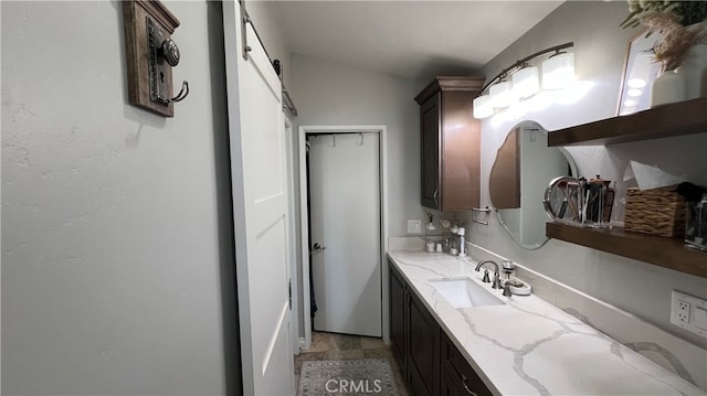 bathroom featuring lofted ceiling, vanity, and tile patterned floors