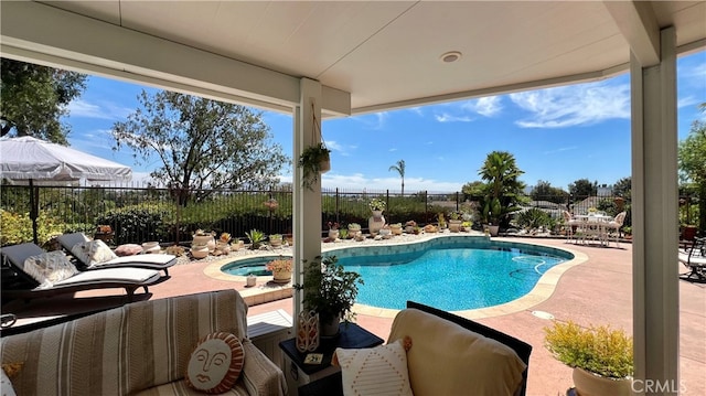 view of pool featuring a patio area