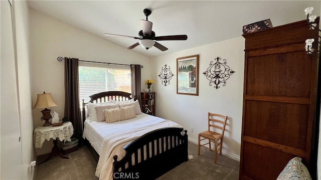 carpeted bedroom with ceiling fan and lofted ceiling