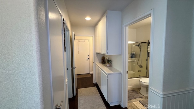 clothes washing area featuring light hardwood / wood-style floors