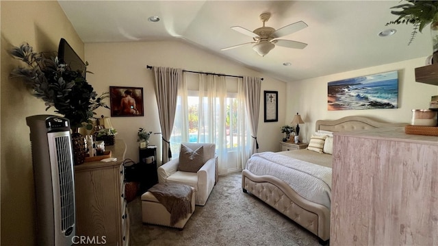 carpeted bedroom featuring ceiling fan and vaulted ceiling