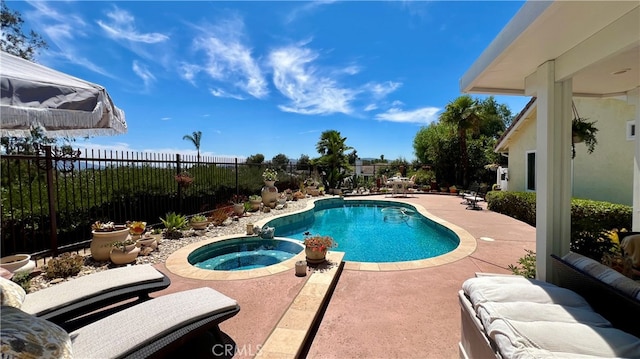 view of pool featuring an in ground hot tub and a patio area