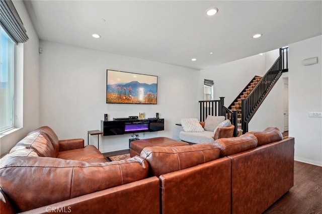 living room with plenty of natural light and hardwood / wood-style floors