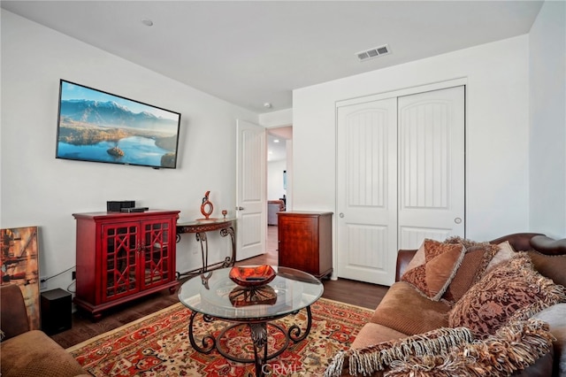 living room with dark hardwood / wood-style floors