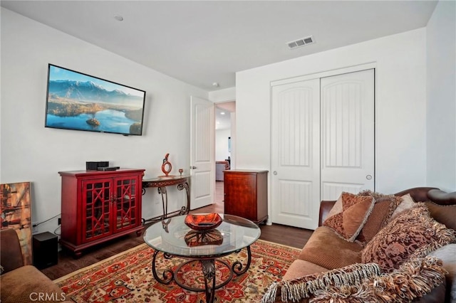 living area with wood finished floors and visible vents