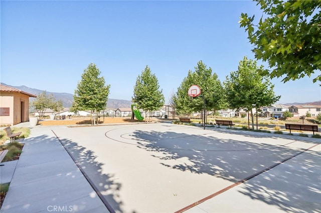 view of basketball court featuring community basketball court and a mountain view