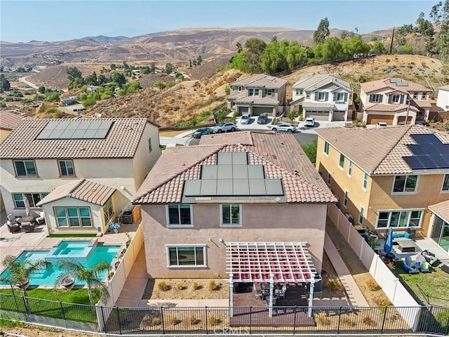 aerial view featuring a mountain view and a residential view