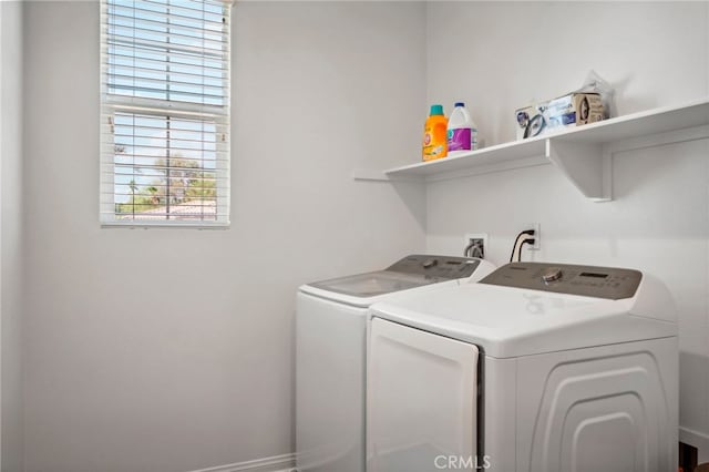 washroom featuring washing machine and dryer