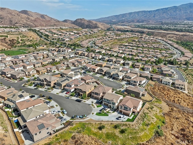 birds eye view of property with a mountain view