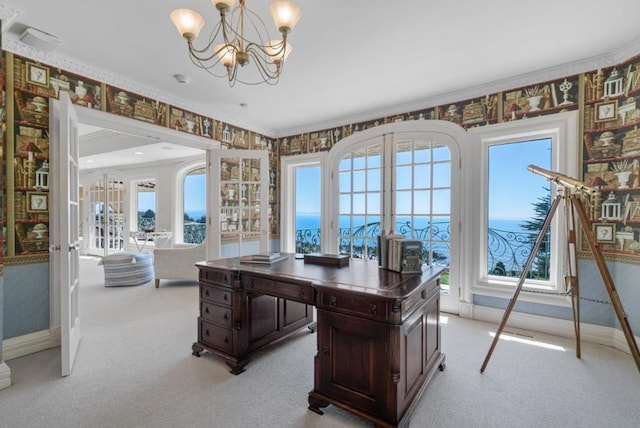 home office featuring a notable chandelier, crown molding, and light carpet