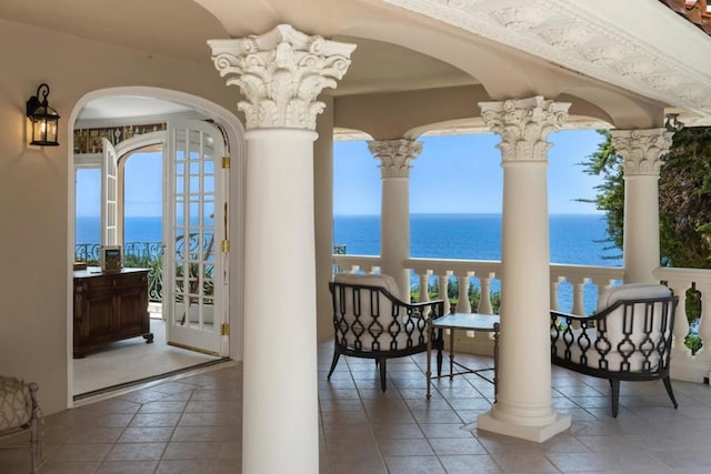 balcony featuring a water view