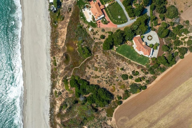 bird's eye view featuring a water view and a view of the beach