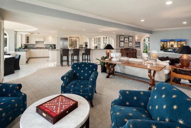 carpeted living room with crown molding