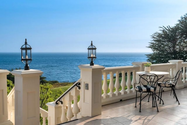 balcony featuring a water view