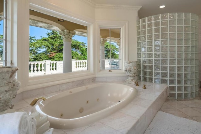 bathroom with tile patterned flooring and a relaxing tiled tub