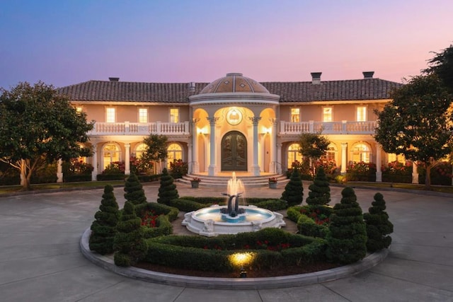 mediterranean / spanish-style home featuring a balcony